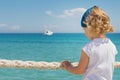 Little girl looks out to sea. Royalty Free Stock Photo