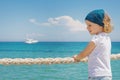 Little girl looks out to sea. Royalty Free Stock Photo