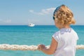 Little girl looks out to sea. Royalty Free Stock Photo