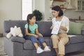 Little girl looks at a picture shown to her by a child psychologist at her reception. Royalty Free Stock Photo