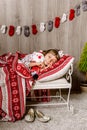 Little girl lying in bed waiting for Christmas Royalty Free Stock Photo