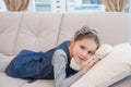 Little girl lying on the couch with teddy Royalty Free Stock Photo