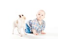 Little girl lying on floor, and nearby is small dog. children and Pets. Royalty Free Stock Photo