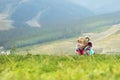 Little girl lying on the green grass