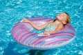 Little girl lying on the inflatable rubber circle