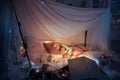 Little girl lying in a teepee, sleeping with the flashlight Royalty Free Stock Photo