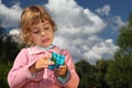 Little girl with magic cube outdoor Royalty Free Stock Photo
