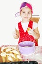 Little girl make and eat croissant Royalty Free Stock Photo