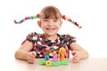 Little girl make family figure with plasticine Royalty Free Stock Photo