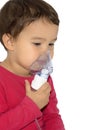 Little girl making aerosol treatment with a rubber masks