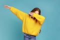 Little girl making dabbing movement, famous internet meme of success victory, following trends.