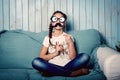 Little girl making faces with mustache props Royalty Free Stock Photo
