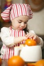 Little girl making fresh juice Royalty Free Stock Photo