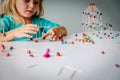 Little girl making geometric shapes, engineering and STEM Royalty Free Stock Photo