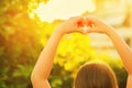 Little girl making heart sign with her hands Royalty Free Stock Photo