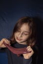 Little girl making homemade slime toy. Relax and Satisfaction