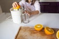 Little girl making orange juice Royalty Free Stock Photo