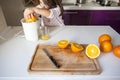 Little girl making orange juice Royalty Free Stock Photo