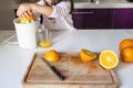 Little girl making orange juice Royalty Free Stock Photo