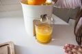 Little girl making orange juice Royalty Free Stock Photo