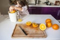 Little girl making orange juice Royalty Free Stock Photo