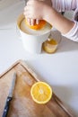 Little girl making orange juice Royalty Free Stock Photo