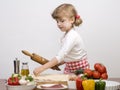 Little girl making pizza Royalty Free Stock Photo