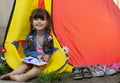 Little girl making plans for summer holidays and vacation, diary notes. Royalty Free Stock Photo