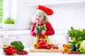 Little girl making salad for dinner Royalty Free Stock Photo