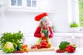 Little girl making salad for dinner Royalty Free Stock Photo