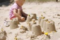 Little girl making sand castles Royalty Free Stock Photo