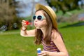 A little girl making soap bubbles Royalty Free Stock Photo