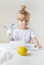 Little girl in a mask for inhalations, making inhalation with nebulizer at home inhaler on the table Royalty Free Stock Photo