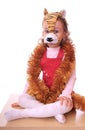 Little girl is in the mask of tiger. Royalty Free Stock Photo