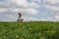 Little girl on meadow