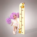 A little girl measures her height. Conceptual image of the process of growing up. 3D renderer