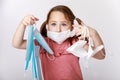 Girl holding many medical and FFP2 masks against a pandemic