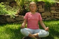 little girl meditating in the garden