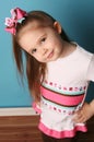 Little girl modeling hair bow and matching shirt Royalty Free Stock Photo