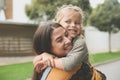 Little girl in Moms hug. Royalty Free Stock Photo