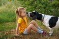Little girl and mongrel dog outdoors