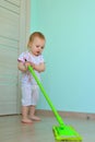 Little girl mopping the floor Royalty Free Stock Photo