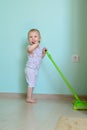 Little girl mopping the floor Royalty Free Stock Photo