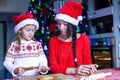 Little girl and mother baking Christmas Royalty Free Stock Photo