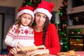 Little girl and mother baking Christmas Royalty Free Stock Photo