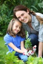 Little girl and mother gardening Royalty Free Stock Photo