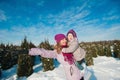 A little girl and mother run and play with the snow, lifestyle, winter holidays Royalty Free Stock Photo