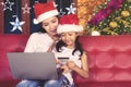 Little girl and mother shopping online with laptop Royalty Free Stock Photo