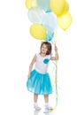 Little girl with multicolored balloons. Royalty Free Stock Photo