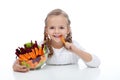 Little girl munching on a carrot stick Royalty Free Stock Photo